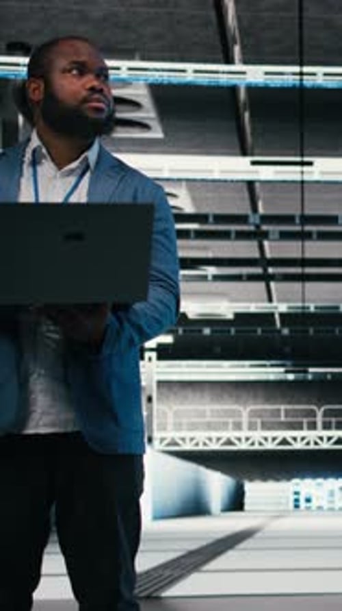 Vertical Video Optimizing Electronics Laptop and Team of Software Developers in Server Farm