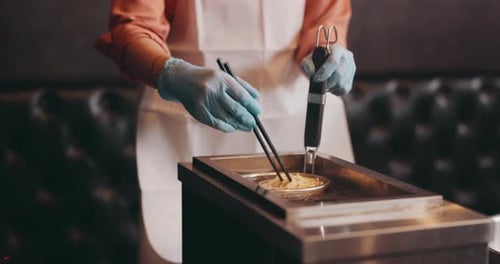 Cooking Noodles in a Small Fryer with Chopsticks