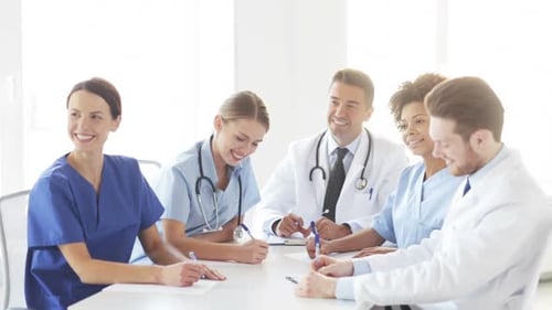Hospital, Profession, People and Medicine Concept - Group of Happy Doctors Meeting