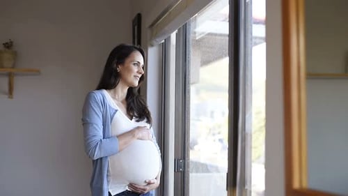 Happy Pregnant Woman with Big Tummy Relax at Home. Portrait of Pregnant