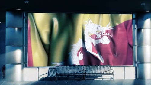 Drapeau national du Bhoutan affiché sur un écran numérique à l'aéroport