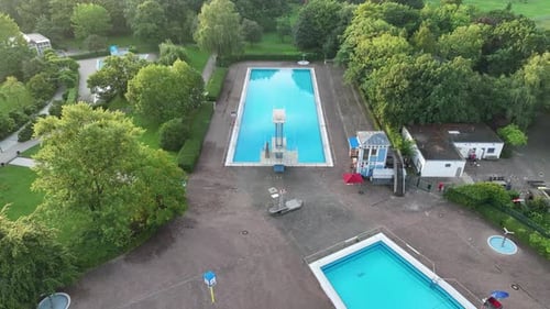 Aerial view of public pools surrounded by greenery, Germany.