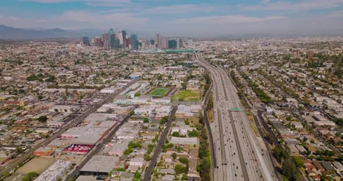 Multiple cars moving to and from financial downtown Los Angeles, California.