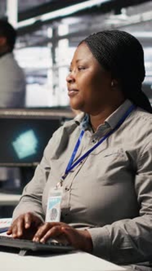 Vertical Video Data Center Computer Scientist Using PC to Monitor Artificial Intelligence