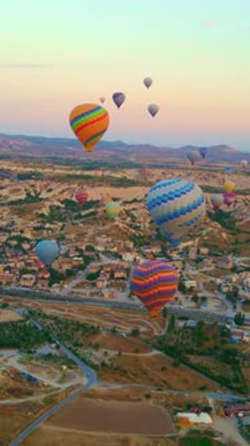 Vertical Video In This Aerial Video the Skies Above Cappadocia Turkey Come Alive with a Kaleidoscope
