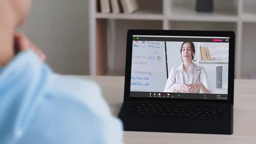Woman Presenting Business Data in a Video Conference