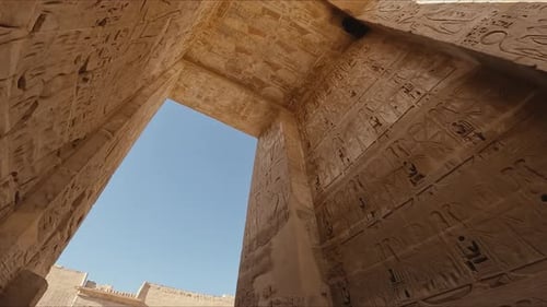 Ancient Egyptian Temple Interior with Hieroglyphics and Open Sky