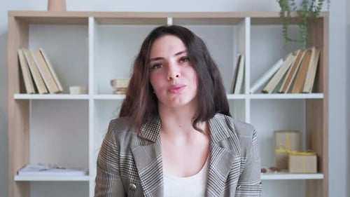 Friendly Woman Presenting Information on Video Call