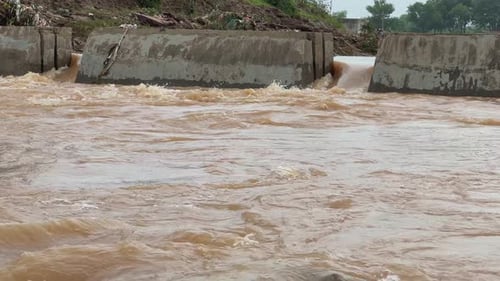 Stop Dam or concrete structures to manage the river's flow,