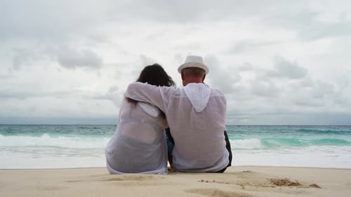 Rear View of Couple Spending Leisure Time at Beach