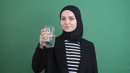 Muslim Woman Drinking Water