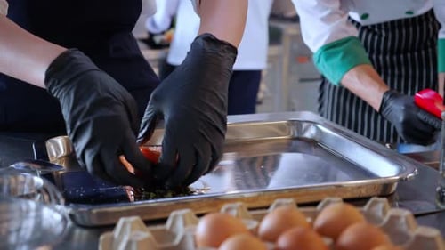 Chef Prepares Salmon in Commercial Kitchen