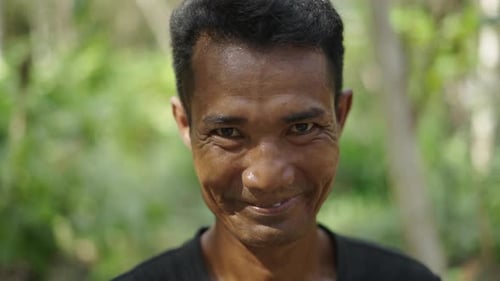 Smiling Adult in Tropical Outdoor Setting