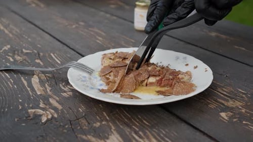Exquisite Meat Dish with Truffle Being Sliced
