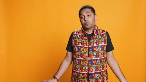 Man Shrugging Shoulders Unable to Provide Answer Studio Background