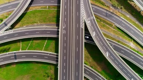 Amazing Aerial Lockdown View of Cars Moving Through Large Complex Highway Junction Interchange