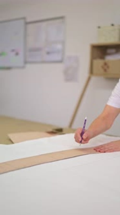 Creative Hands Drawing Pattern Designs with Rulers and Pencils