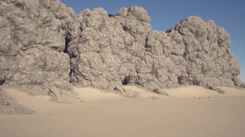 Isolated Rocky Formations and Dunes Under Intense Shadow Play for Filming