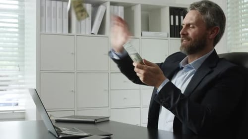 Throwing Cash in Dramatic Money Rain Business Man Throwing Dollars with Flying Cash Effect Office