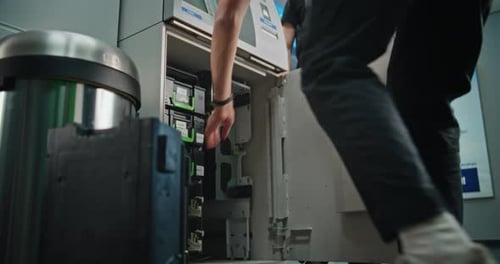 Professional Technicians Performing ATM Cash Collection Procedure Servicing ATM Machine
