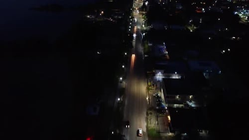 Drone Shot of City at Night with Cars and City Lights