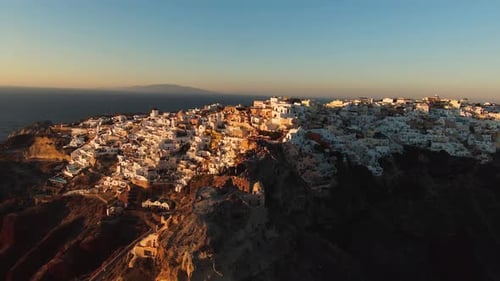 Aerial View of Picturesque Santorini Village at Sunrise
