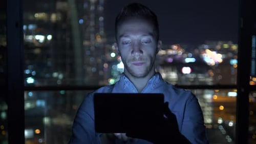 Young Handsome Man Using Tablet Screen on Business Travel