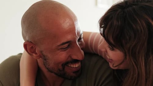 Loving Couple Laughing Together Indoors