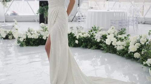 Woman in Wedding Dress Posing at Wedding Event