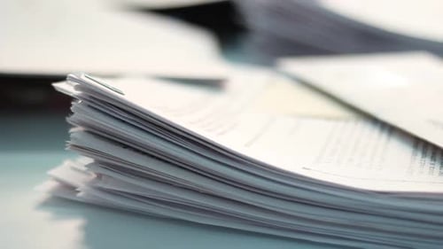 Files Loaded on a Desk in the Office