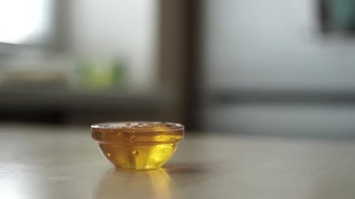 honey dripping from spoon