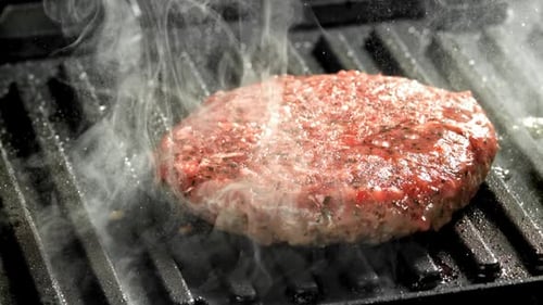 Beef Burger is Fried in a Grill Pan Filmed on a Highspeed Camera at 1000 Fps