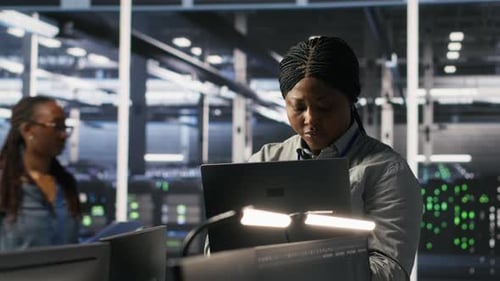 Portrait of Happy Technician Next to Data Center Colleagues Review AI Systems