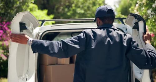 Delivery Man unloading Packages in Suburban Setting