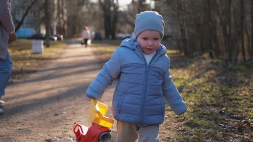 Happy Family Outdoor Mother Child on Walk in Park Mom Playing with Baby Son Outdoor Woman Little