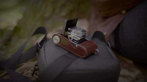 Vintage Camera on a Bag in Nature