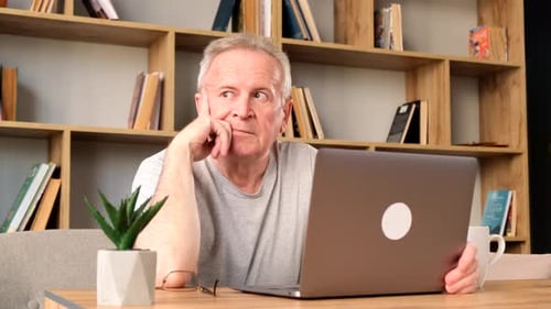 Elderly Men Work Hard Their Eyes Hurt Sitting in the Office He is Stressed