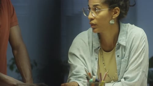 Creative Team Collaborating on Project in Workplace