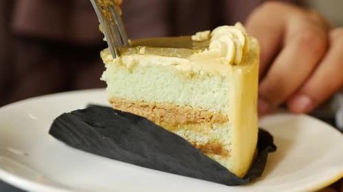 Cake Slice Being Cut by Fork Close Up