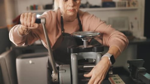 Professional Jeweler Operating a Rolling Mill Machine