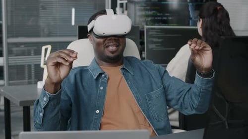 Black Man Using VR Glasses in Office