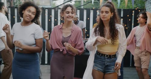 Slow Motion Portrait of Attractive Women Diverse Group Dancing Together at Outdoor Party in Cafe