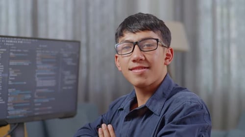 Asian Boy Programmer Smiling And Crossing Her Arms While Creating Software Engineer Developing App