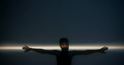 Portrait of Young Adult with Arms Outstretched