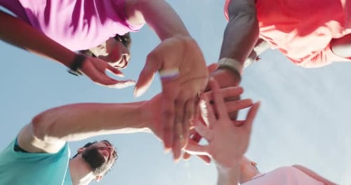 Diverse Group Teamwork with Hands Together Birds Eye View