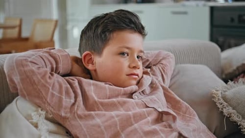 Smiling Child Resting Sofa at Living Room Closeup Lazy Kid Watching Tv Relaxing