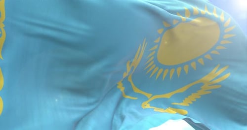 Kazakhstan Flag Waving Against Blue Sky