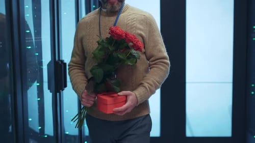 Man Brings Flowers to Woman in Server Room