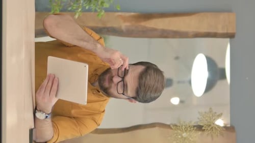 Man With Tablet Reacts to Success