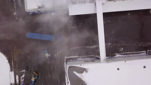 Aerial top view of a modern logistics center with semi trailer trucks